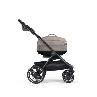 A Dupree I Pet Car Seat, in merle, and attached to the Roscoe Trek 2.0 Pet Stroller Frame from a side profile.