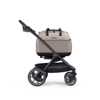 A Hendrick Pet Car Seat, in tawny, and attached to the Roscoe Trek 2.0 Pet Stroller Frame from a side profile.