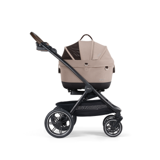 A Maeve iso 5x Pet Car Seat closed, in fawn, and attached to the Roscoe Trek 2.0 Pet Stroller Frame from a side profile.