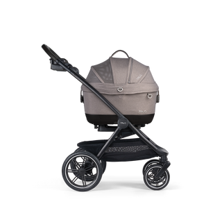 A Maeve iso 5x Pet Car Seat closed, in merle, and attached to the Roscoe Trek 2.0 Pet Stroller Frame from a side profile.
