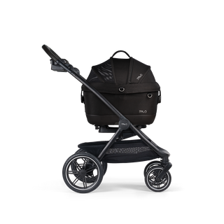 A Maeve iso 5x Pet Car Seat closed, in onyx, and attached to the Roscoe Trek 2.0 Pet Stroller Frame from a side profile.