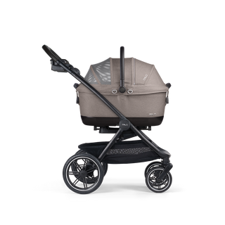 A Maeve iso 6x Pet Car Seat closed, in merle, and attached to the Roscoe Trek 2.0 Pet Stroller Frame from a side profile.