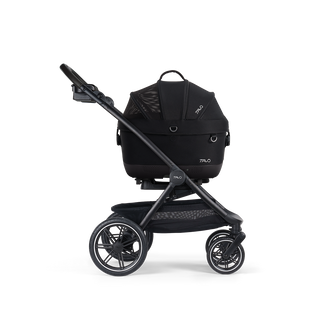 A Maeve iso Wind 5x Pet Car Seat closed, in onyx, and attached to the Roscoe Trek 2.0 Pet Stroller Frame from a side profile.