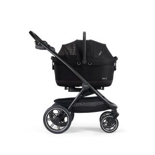 A Maeve iso Wind 6x Pet Car Seat closed, in onyx, and attached to the Roscoe Trek 2.0 Pet Stroller Frame from a side profile.