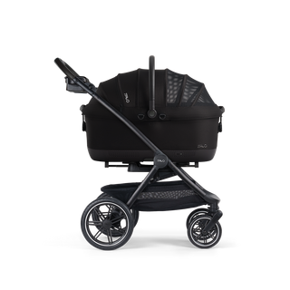 A Maeve iso Wind 7x-R Pet Car Seat closed, in onyx, and attached to the Roscoe Trek 2.0 Pet Stroller Frame from a side profile.