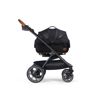A Maeve Small Flex Pet Car Seat closed, in onyx, and attached to the Roscoe Trek 2.0 Pet Stroller Frame from a side profile.