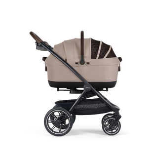A Maeve iso Wind 7x-R Pet Car Seat closed, in fawn, and attached to the Roscoe Trek 2.0 Pet Stroller Frame from a side profile.