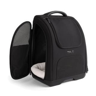 A Kamella Pet Backpack and Car Seat, in onyx, with one of the side doors unzipped.