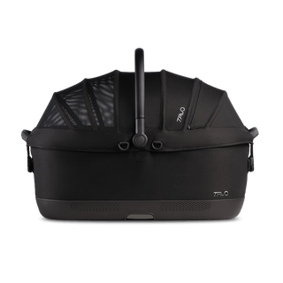 A Maeve iso 7x  Pet Car Seat in the fashion onyx from the side with the canopy closed