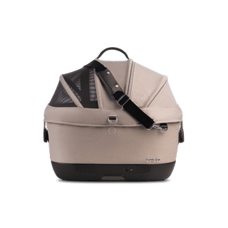 A Maeve iso 5x Wind Pet Car Seat in the fashion fawn from the side with the canopy closed