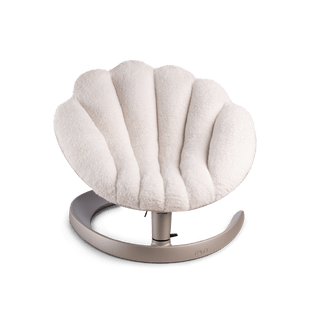 Front view of a shell-shaped white plush pet bed on a brushed bronze c-shaped frame