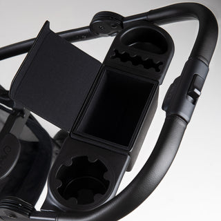 Accessory bar with black leatherette accents attached to pet stroller frame