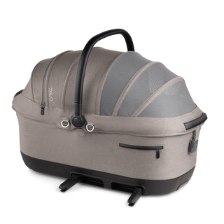 A Maeve iso 7x-R Pet Car Seat in the fashion merle on an angle with the ISOFIX latches out