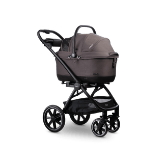 A Maeve iso 6x Wind travel system in the fashion ashen with the car seat canopy closed 