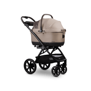 A Maeve iso 6x Wind travel system in the fashion fawn with the car seat canopy closed 
