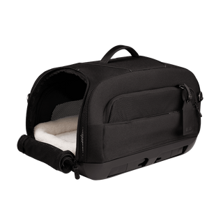 open three-quarter view of black pet car seat with unzipped mesh side door and white comfort liner inserted - view 3