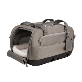 open three-quarter view of gray pet car seat with unzipped mesh side door and white comfort liner inserted with two carry handles at the top - view 2