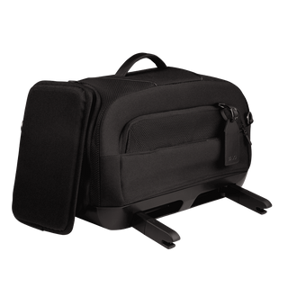three-quarter  view of compact, black pet car seat featuring attached side impact protection, extended ISOFIX latches, and black luggage tag - view 4