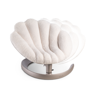 Front view of a shell-shaped white plush pet bed on a brushed bronze c-shaped frame with two semi-transparent overlay images showing the swaying function of the bed