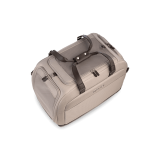 An tawny fashion Hendrick Pet Car Seat with a side door rolled open showing a durable mattress and an interior leash