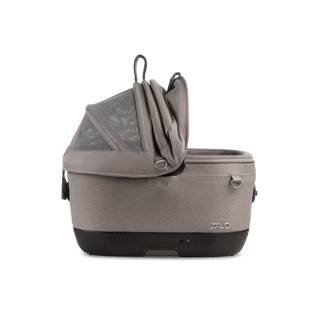 A Maeve iso 5x Wind Pet Car Seat in the fashion merle from the side with the right side of the canopy open