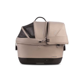 A Maeve iso 5x Wind Pet Car Seat in the fashion fawn from the side with the canopy closed and the SIP on