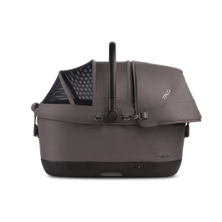 A Maeve iso 6x Wind Pet Car Seat in the fashion ashen from the side with the canopy closed and the SIP on