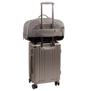 Tavo Pets Dupree I crash-tested pet car seat in Merle gray with luggage sleeve on suitcase