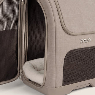 Unzipped side-door of Kamella pet backpack showing machine-washable mattress pad.