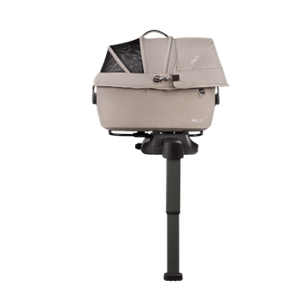 side view of beige small pet car seat on base with extended load leg and side impact protection, fawn