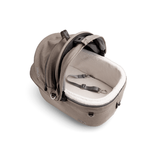 top view of beige small pet car seat with canopy open and leash with white comfort liner, fawn