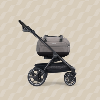 A Dupree II Pet Car Seat, in merle, and attached to the Roscoe Trek 2.0 Pet Stroller Frame from a side profile.