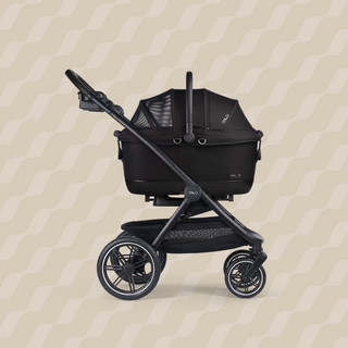 A Maeve iso 6x Pet Car Seat closed, in onyx, and attached to the Roscoe Trek 2.0 Pet Stroller Frame from a side profile.